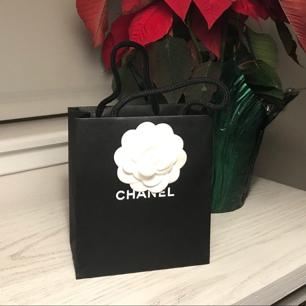 Chanel shopping bag and Camilla flower